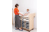 Double changing unit with compartments for plastic containers