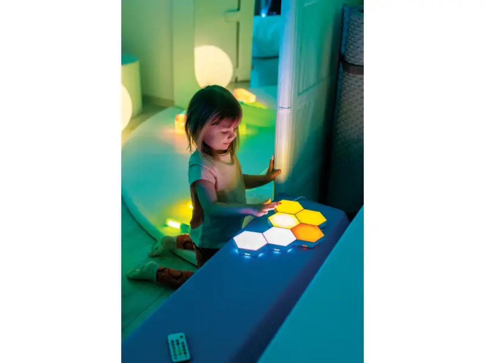Illuminated colourful wall panels. Honeycombs