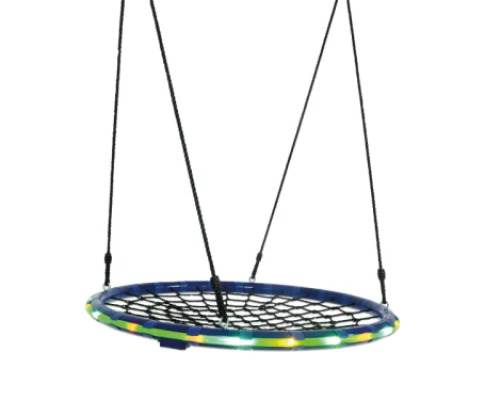 Illuminated stork's nest with spiderweb. Therapeutic swing