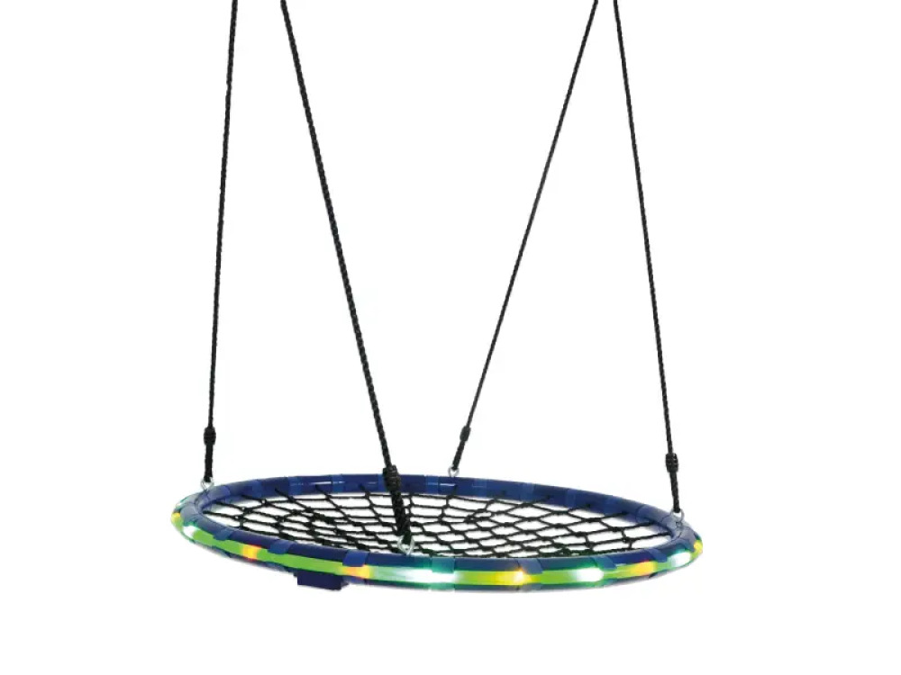 Illuminated stork's nest with spiderweb. Therapeutic swing