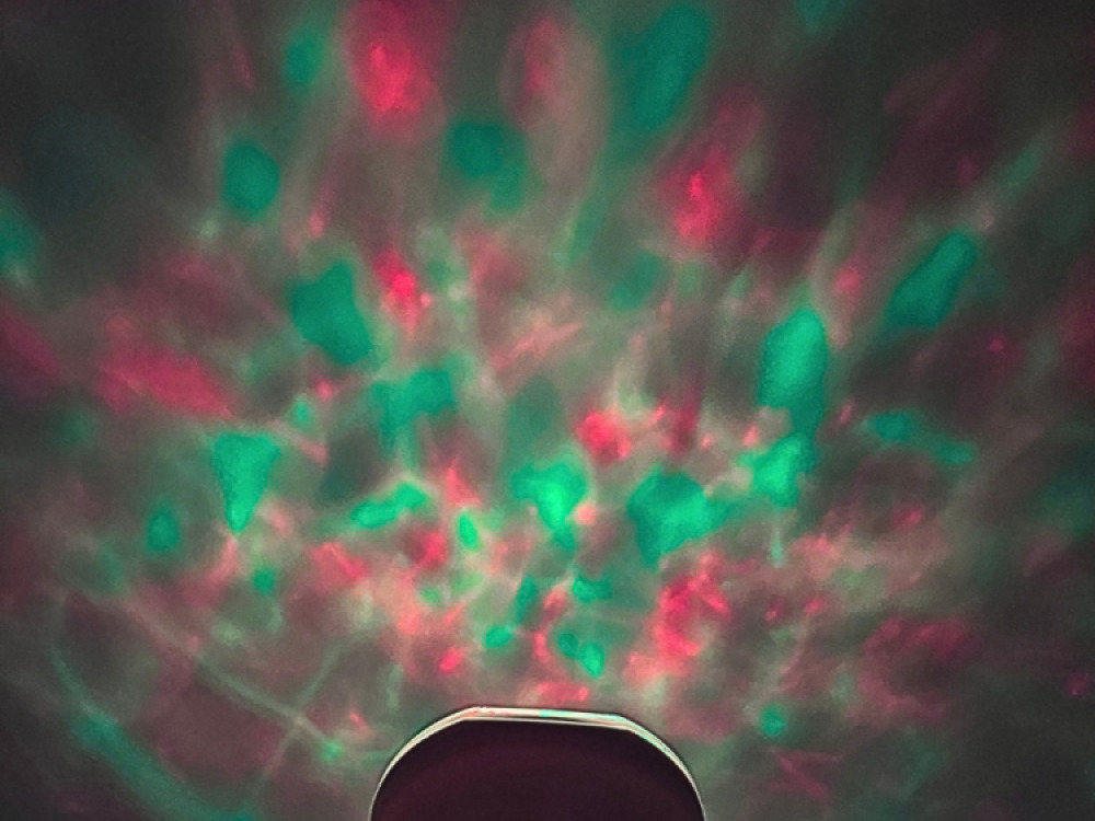 Ocean wave projector with sounds and speaker.
