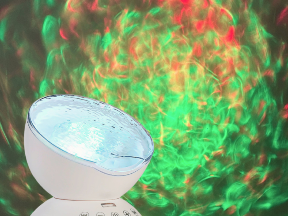 Ocean wave projector with sounds and speaker.