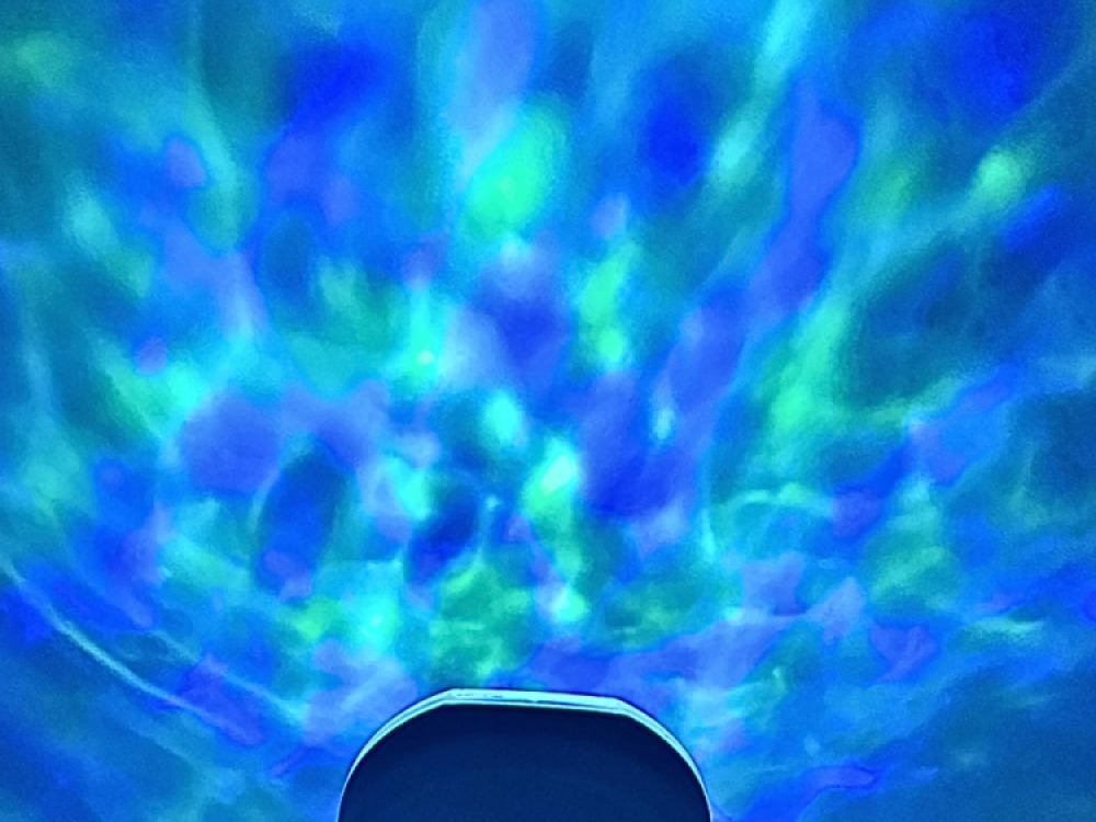 Ocean wave projector with sounds and speaker.