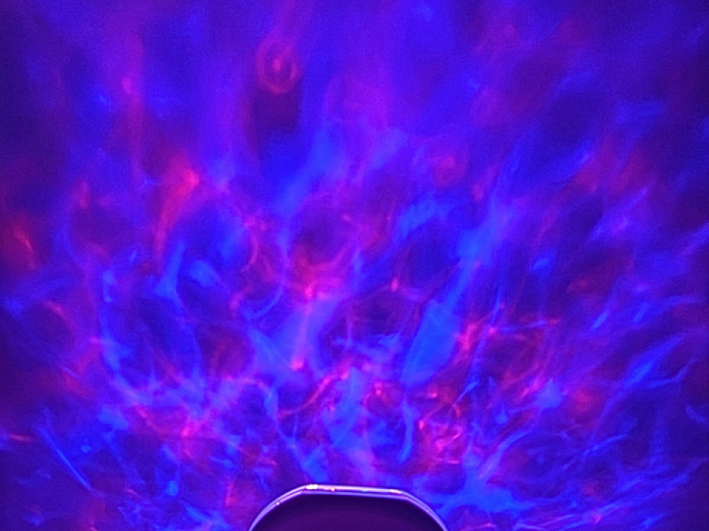 Ocean wave projector with sounds and speaker.