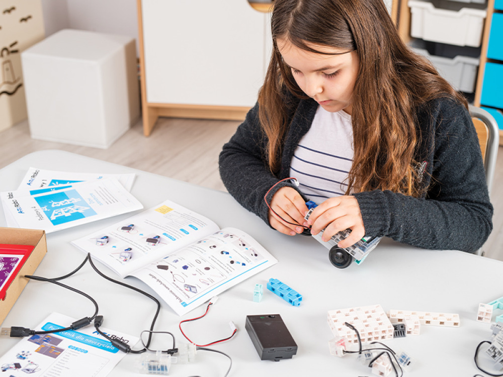 Educational kit with a robot, worksheets and lesson scenarios