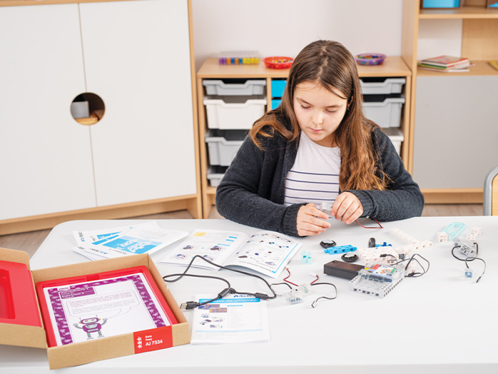Educational kit with a robot, worksheets and lesson scenarios